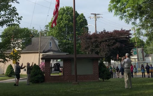 Mr. Costanzo, HS History teacher, plays “To the Colors”